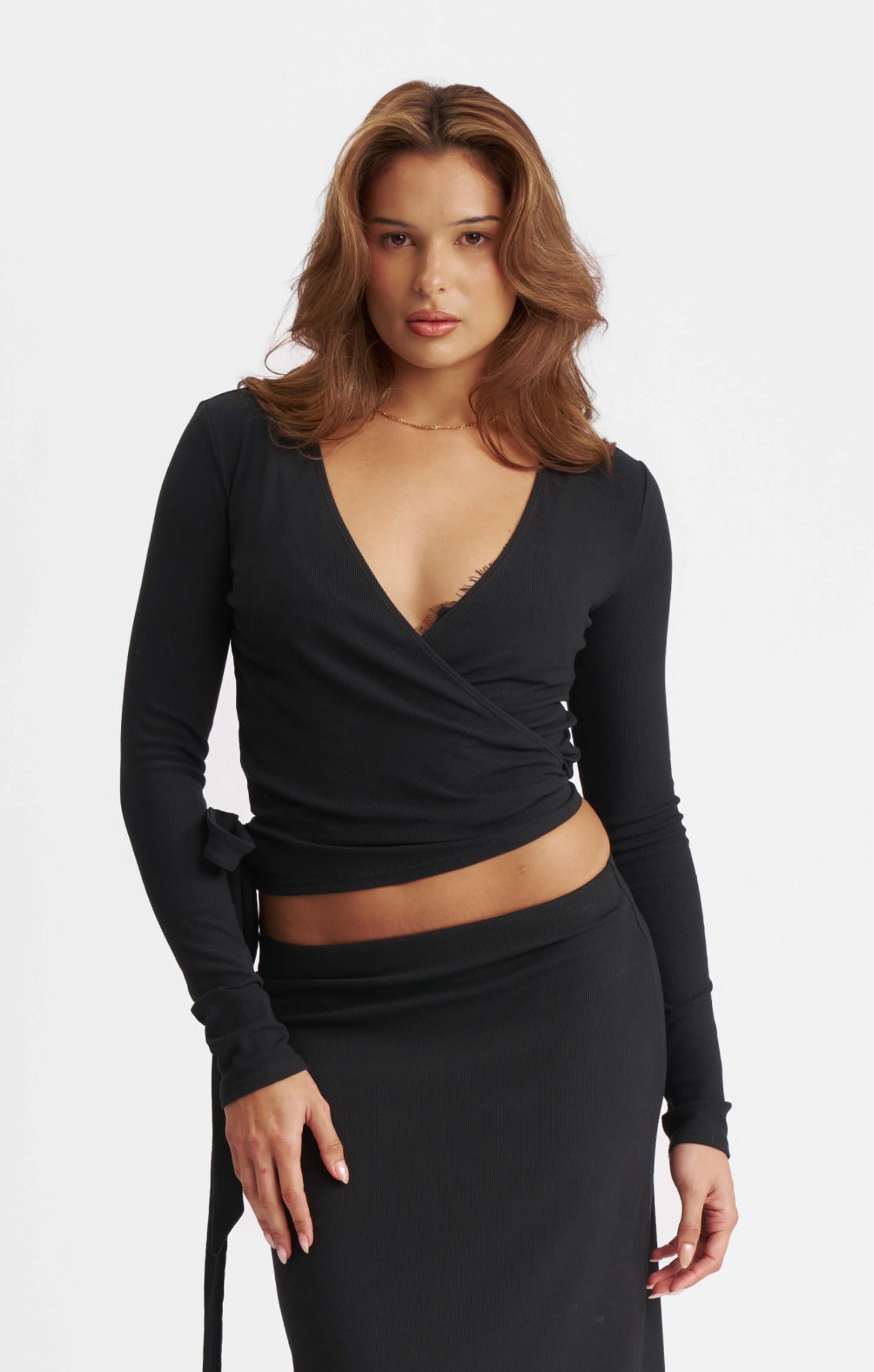 THE LUXE RIB LONG SLEEVE WRAP TOP - BLACK